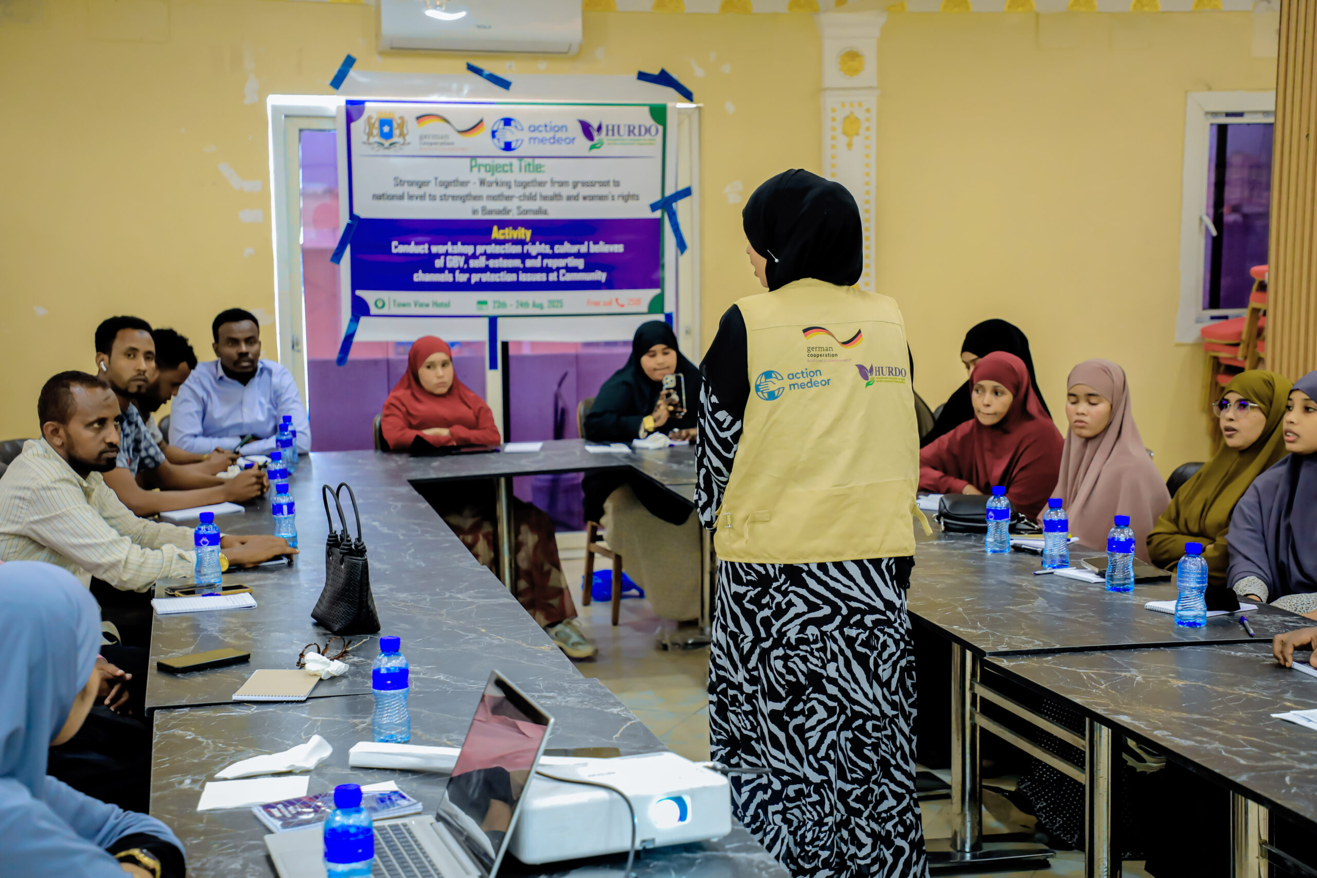 HURDO facilitator leading a workshop with participants around a meeting table