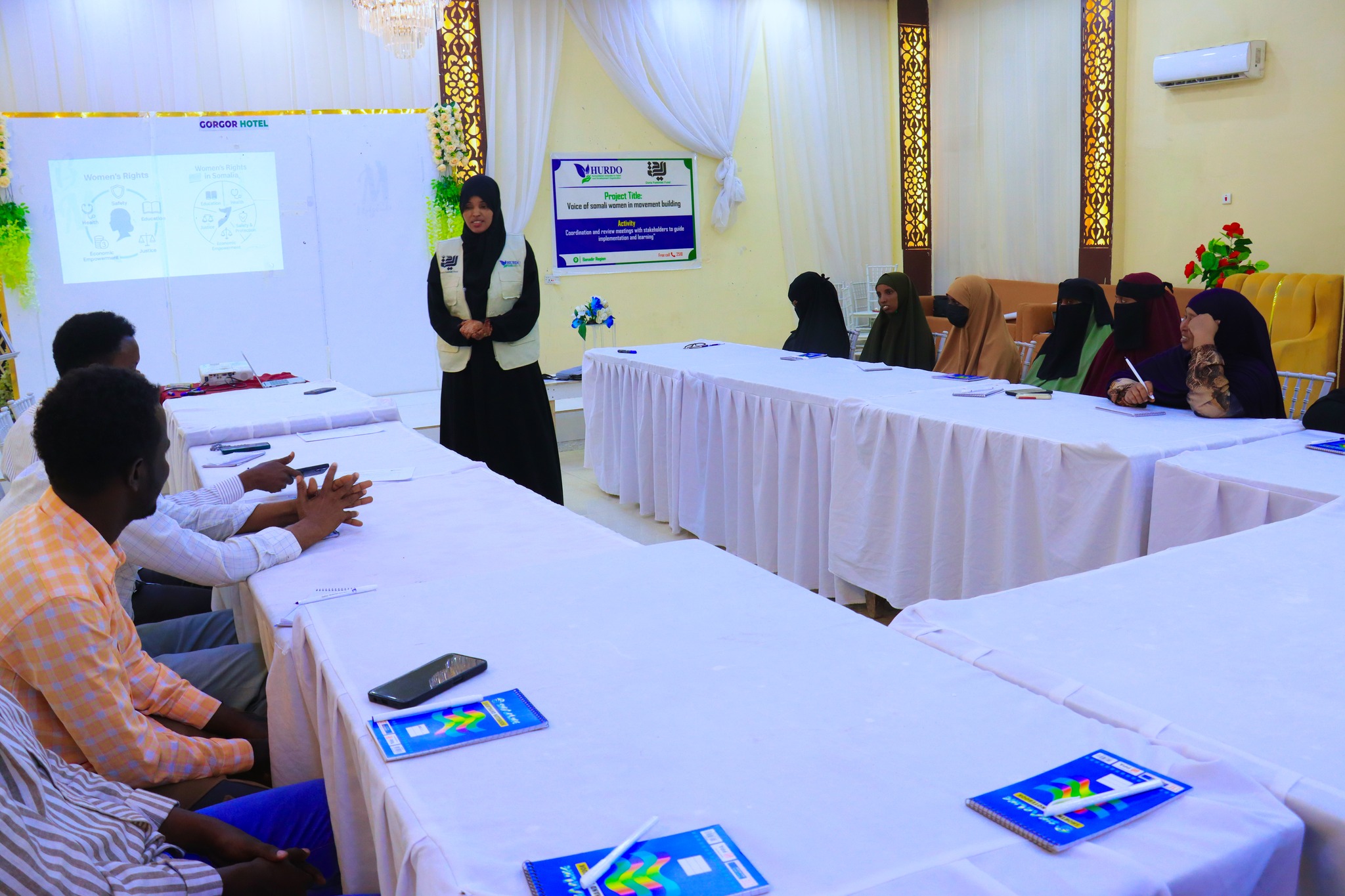 HURDO staff presenting during a coordination meeting