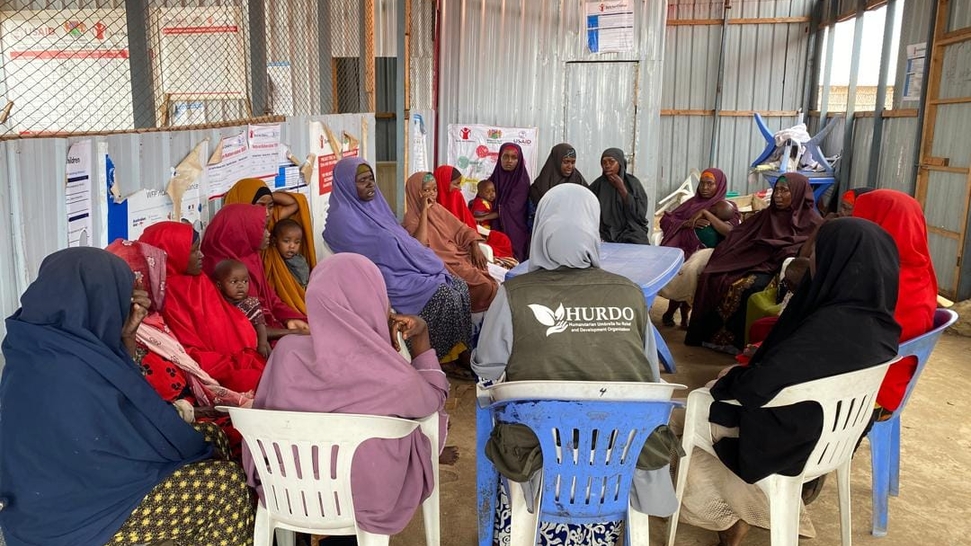 Women and children in a HURDO community health discussion